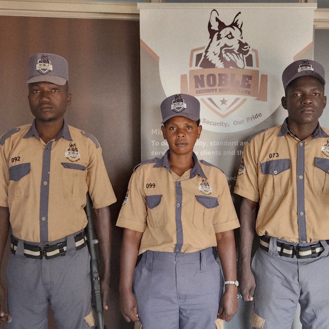 Portrait of three uniformed Noble Security officers